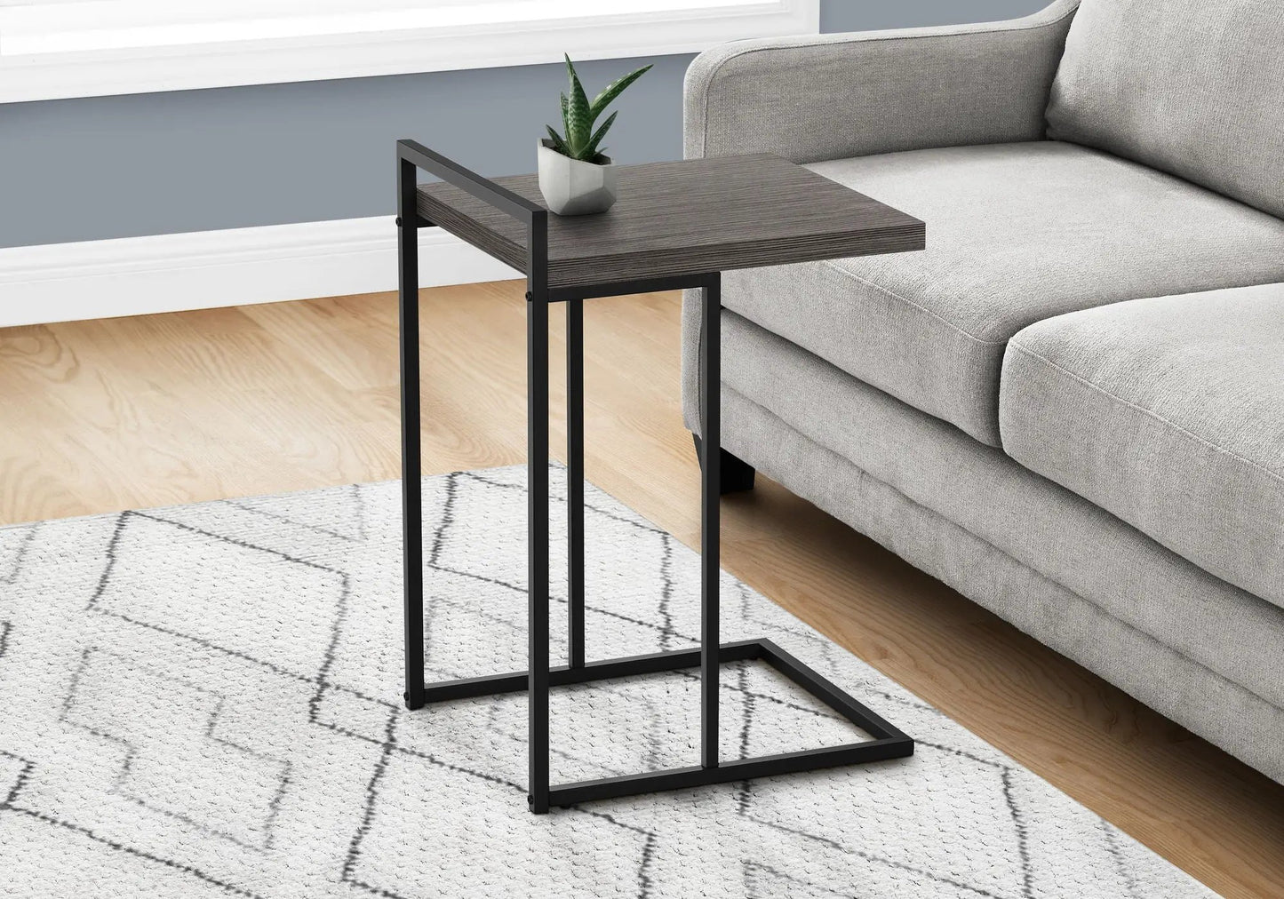 C-shaped accent table with dark wood top and black metal frame; Unique Piece Furniture end table on Tampa Home & Garden Store