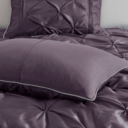 Seven Piece Tufted Comforter Set in a Plum