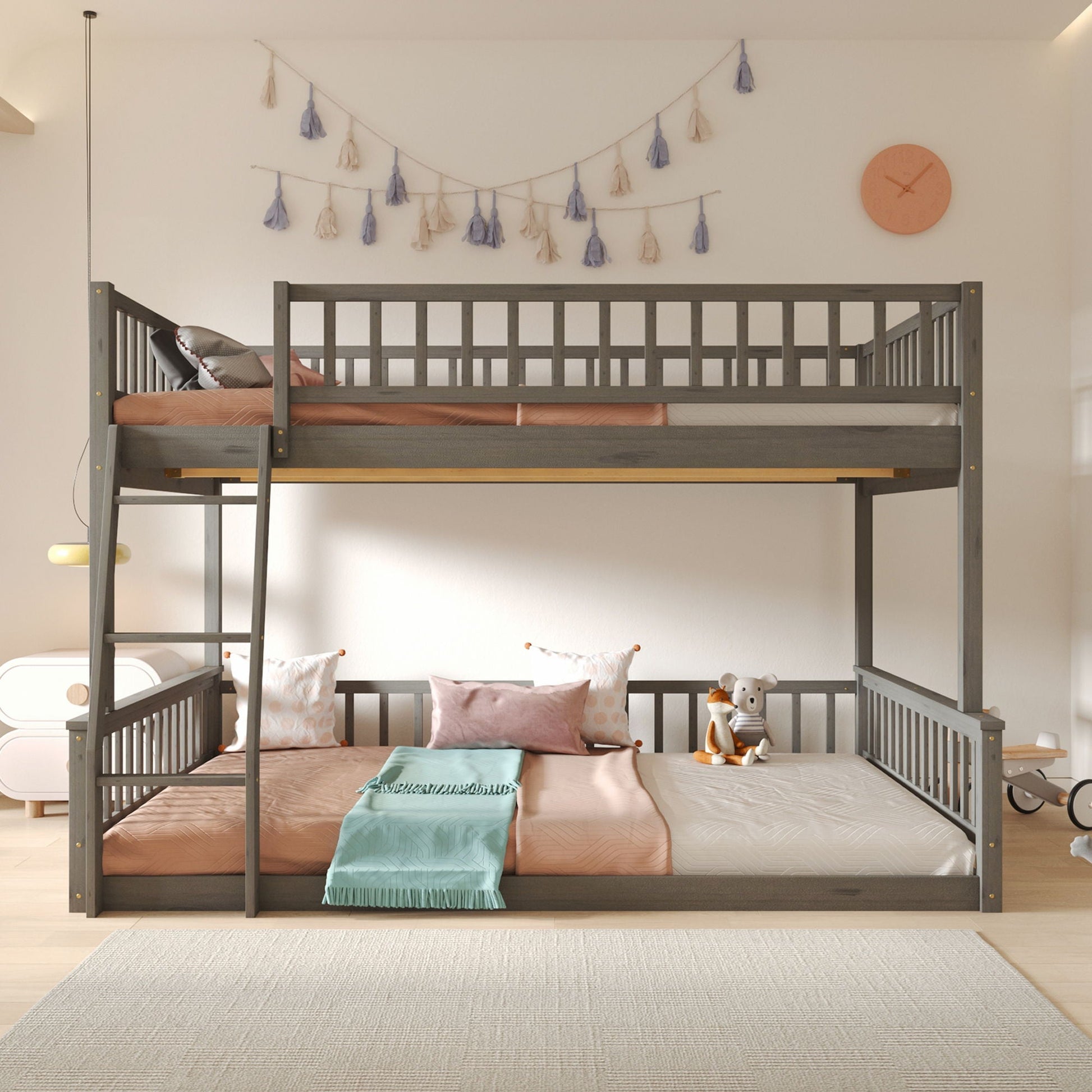 Bunk bed with ladder and guardrails in dark gray wood with peach bedding on Tampa Home & Garden Store