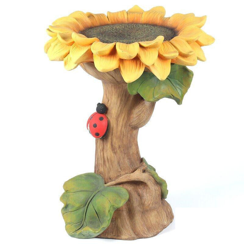 Cute Squirrel Bird Feeder in tree trunk with sunflower top and ladybug accent on Tampa Home & Garden Store