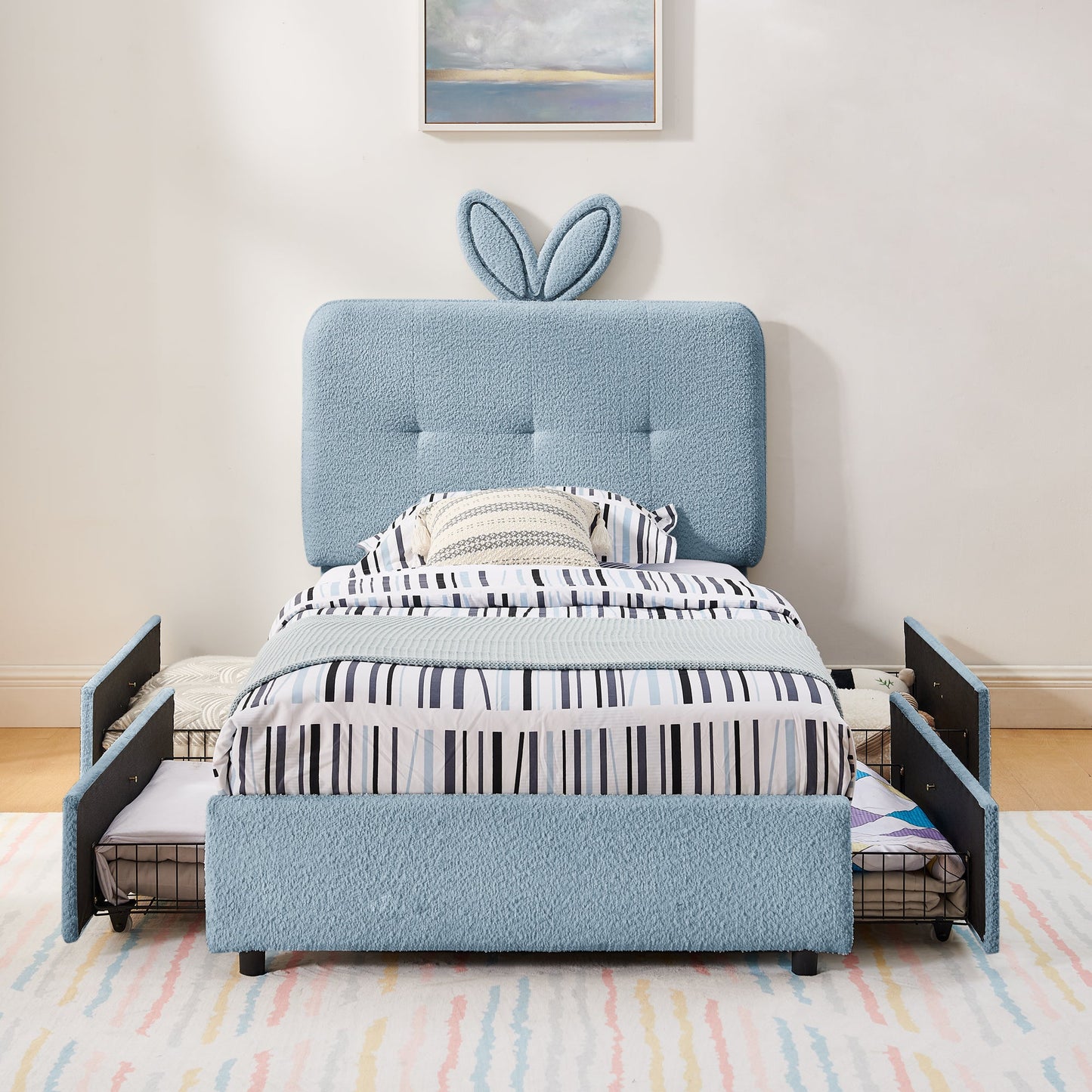 Twin size kids upholstered bed with oversized blue rabbit ear headboard and striped bedding on Tampa Home & Garden Store