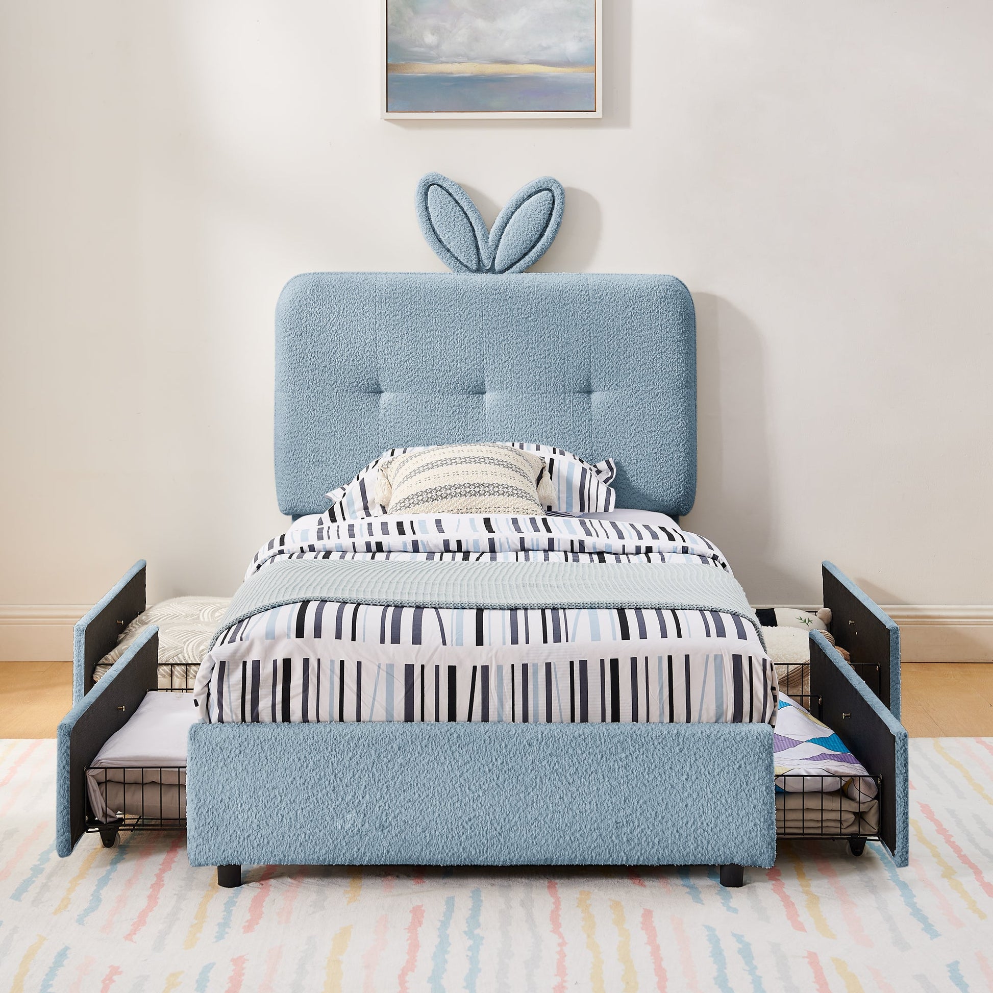 Twin size kids upholstered bed with oversized blue rabbit ear headboard and striped bedding on Tampa Home & Garden Store