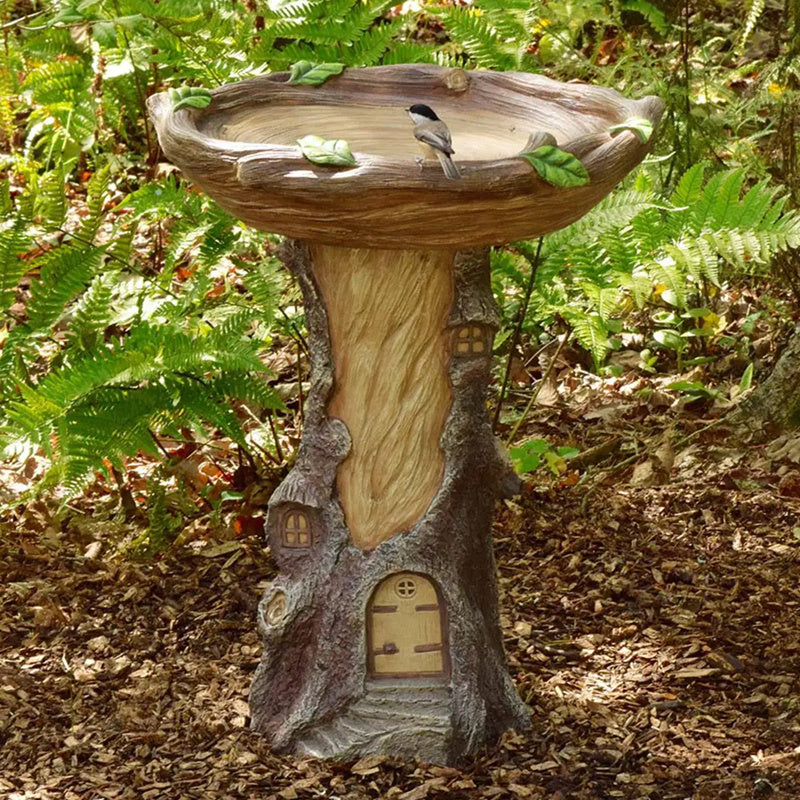 Sunflower resin bird bath garden ornament atop a tree-stump pedestal with doors and windows on Tampa Home & Garden Store