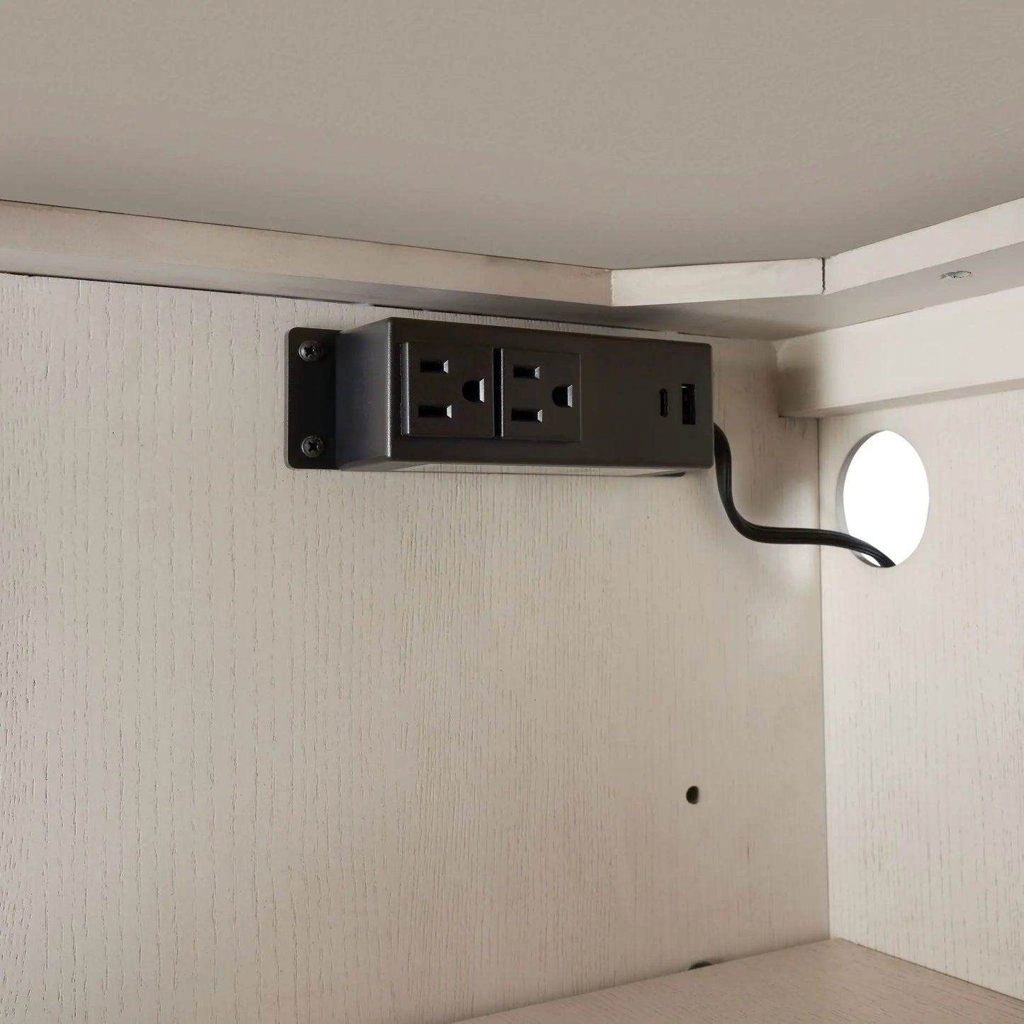 Server with base in white mounted under a shelf with a black power strip and outlets on Tampa Home & Garden Store