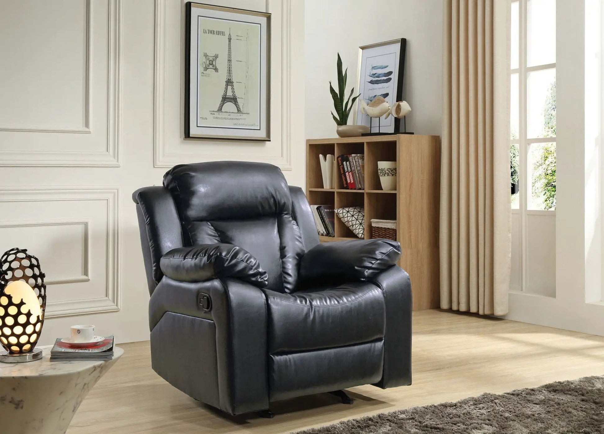 Comfortable Rocking Recliner, black leather with cushioned arms in living room on Tampa Home & Garden Store