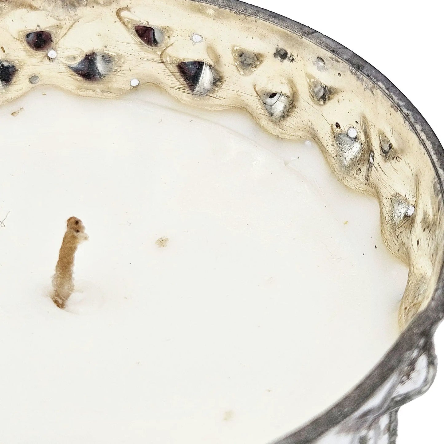 Beige ceramic plate with a textured silver rim and rustic glaze marks on Tampa Home & Garden Store