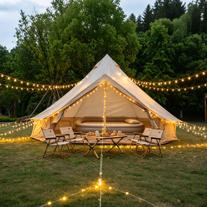 Oxford Bell Tent 13.1ft GemGear with stove jack in beige canvas, dining under lights on Tampa Home & Garden Store