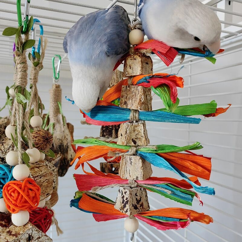 Parrot toys stand with wood segments and bright ribbon wraps, Sell My Stuff brand parrots on Tampa Home & Garden Store