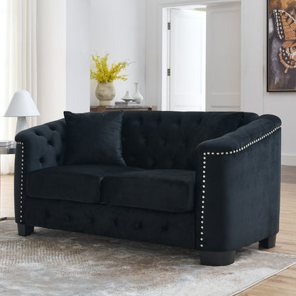 Modern Chesterfield sofa with tufted backrest in black velvet, nailhead trim along arms on Tampa Home & Garden Store