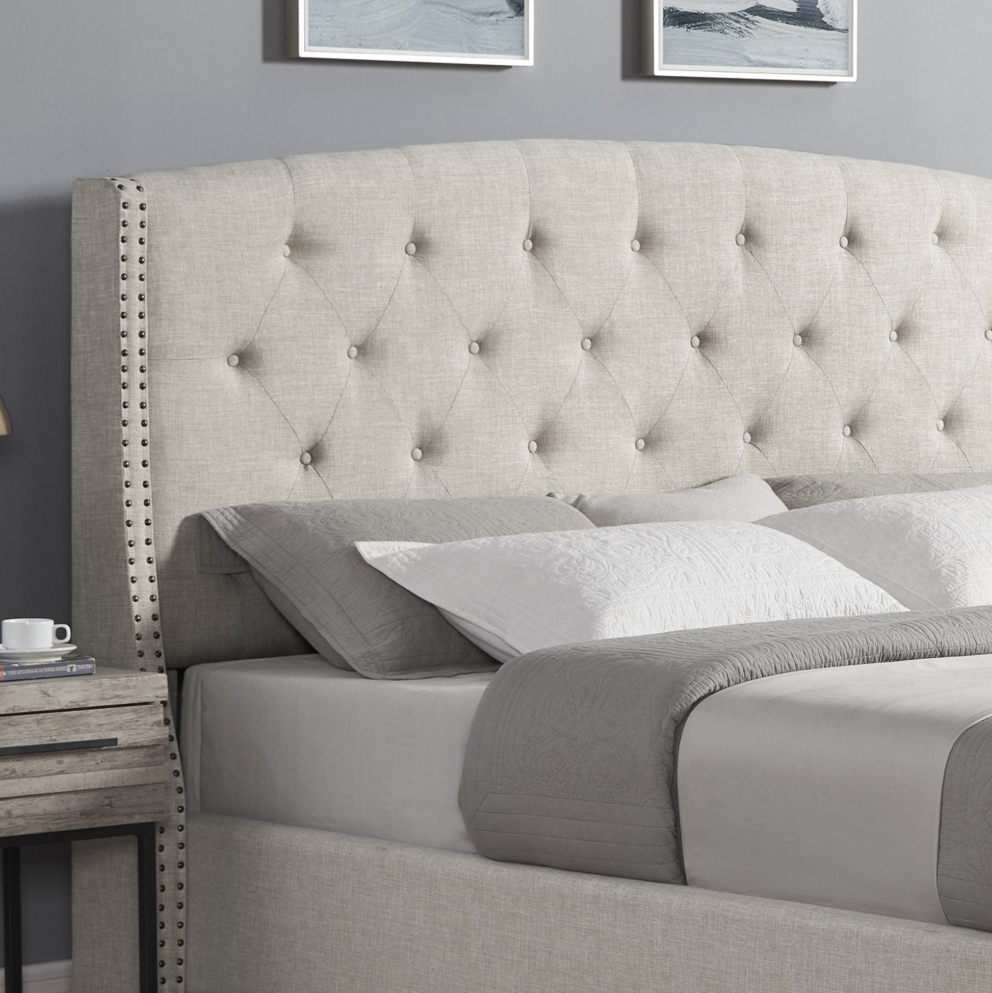 Astral tufted wingback bed in light grey upholstery with nailhead trim and white nightstands on Tampa Home & Garden Store