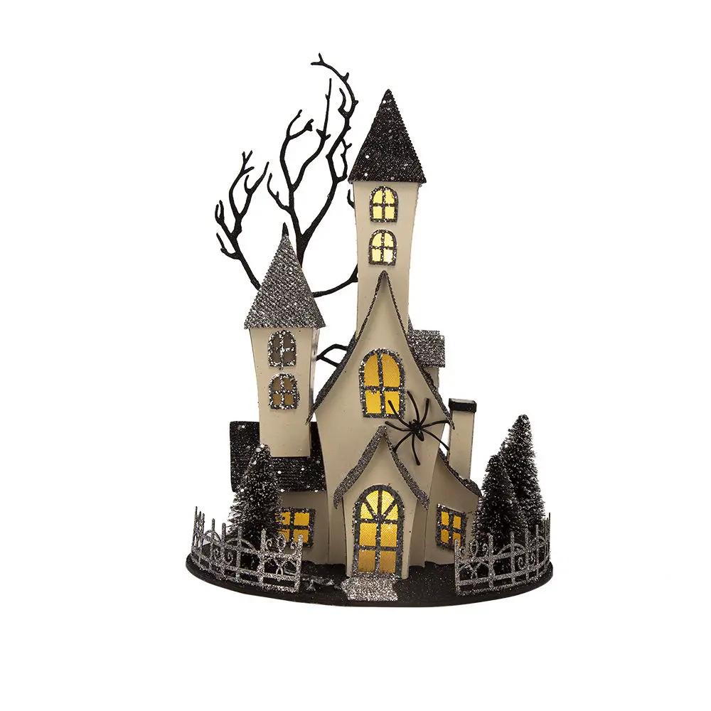 Cardboard lighted haunted house sculpture beige with black roofs and yellow battery powered on Tampa Home & Garden Store