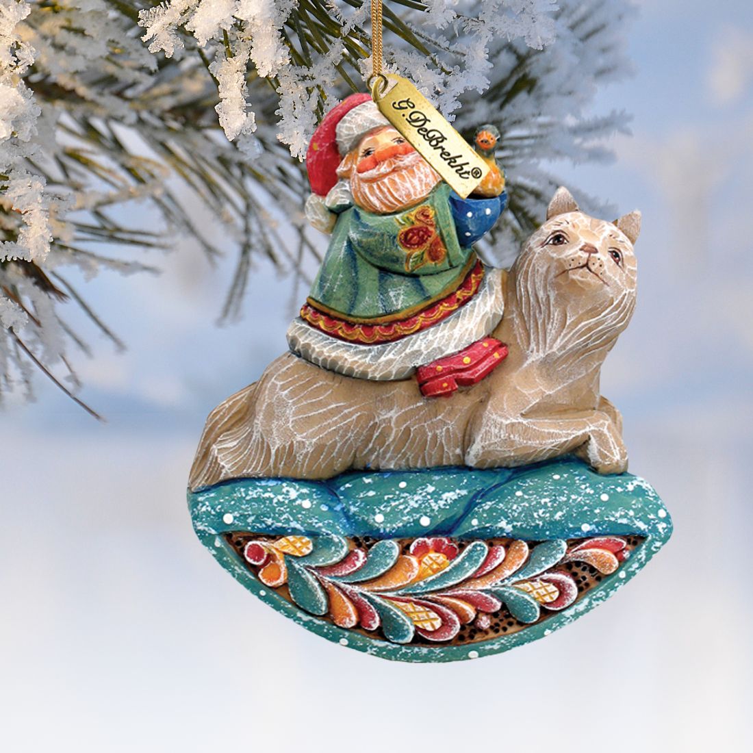 Santa on Wolf Sculpted Ornament hand-painted by G. DeBrekht with teal base snow accents on Tampa Home & Garden Store