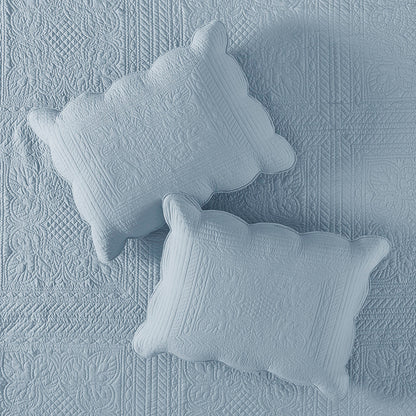 3 Piece Reversible Scalloped Edge Quilt Set in blue with two pillows on a quilted bedspread on Tampa Home & Garden Store