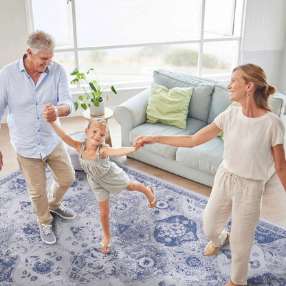 Maval Area Rug blue floral pattern on living room floor with family Tampa Garden Store on Tampa Home & Garden Store
