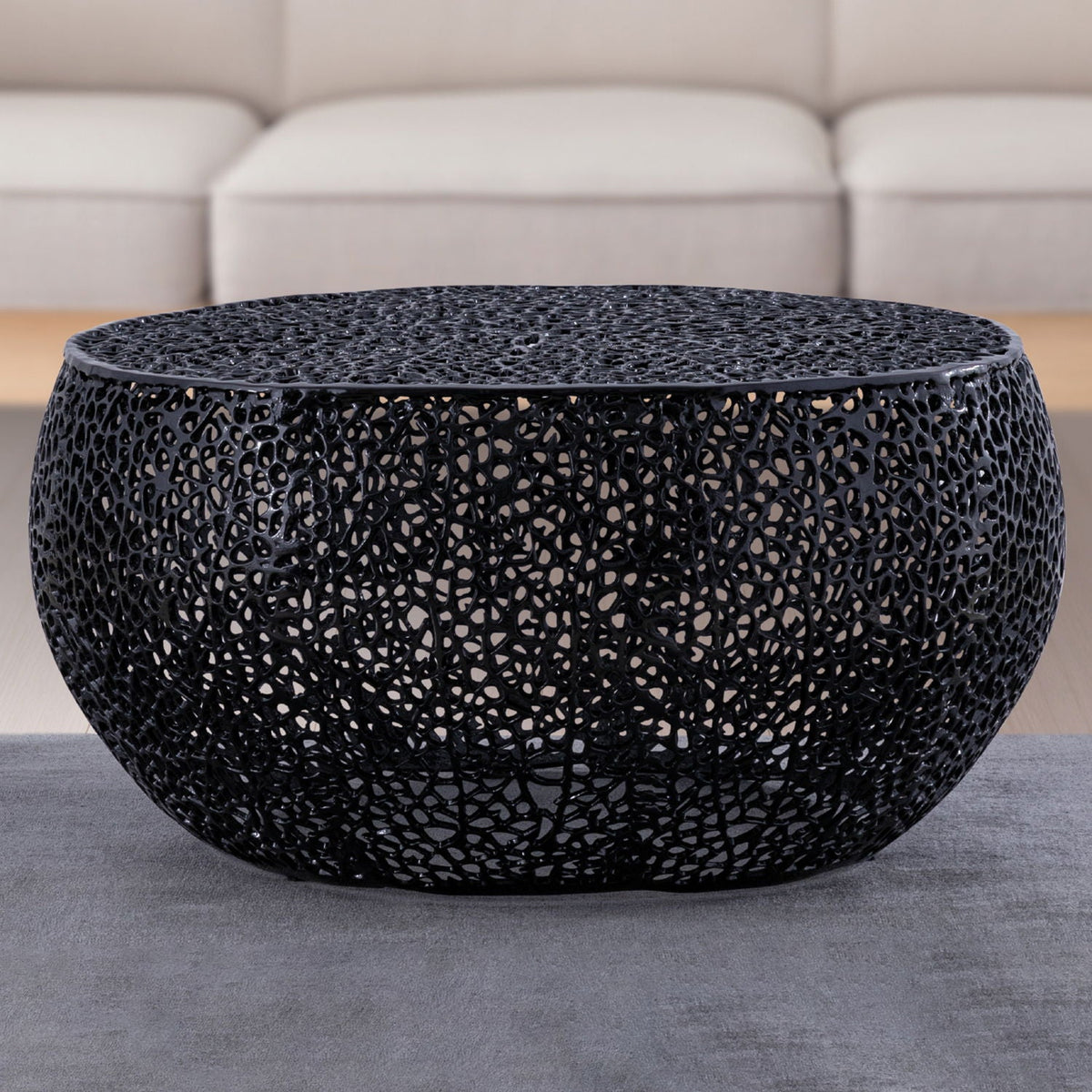 Round black lattice coffee table with aluminum frame for modern living rooms on Tampa Home & Garden Store