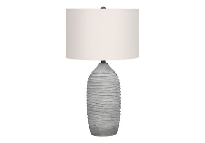Table lamp resin base with gray textured finish and cream fabric shade on Tampa Home & Garden Store