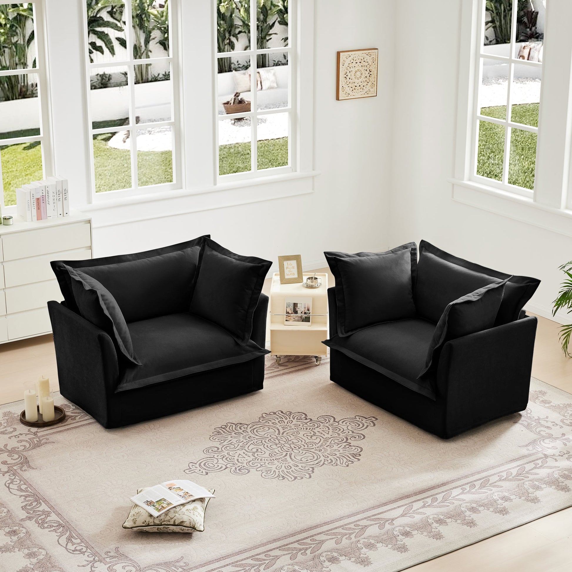 Set of 2 black slipcovered armchairs by HouseOfZazla in a bright white living room on Tampa Home & Garden Store