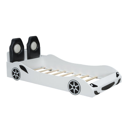 Race car shaped platform bed with black upholstered backrests on a white frame and wheel decals on Tampa Home & Garden Store