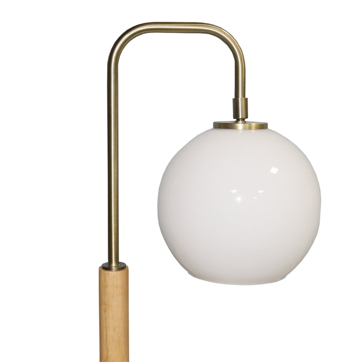 Bedside table lamp with white globe lampshade and brass curved stem on wooden base on Tampa Home & Garden Store