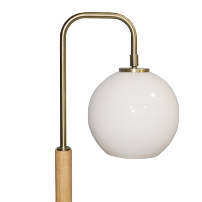 Bedside table lamp with white globe lampshade and brass curved stem on wooden base on Tampa Home & Garden Store