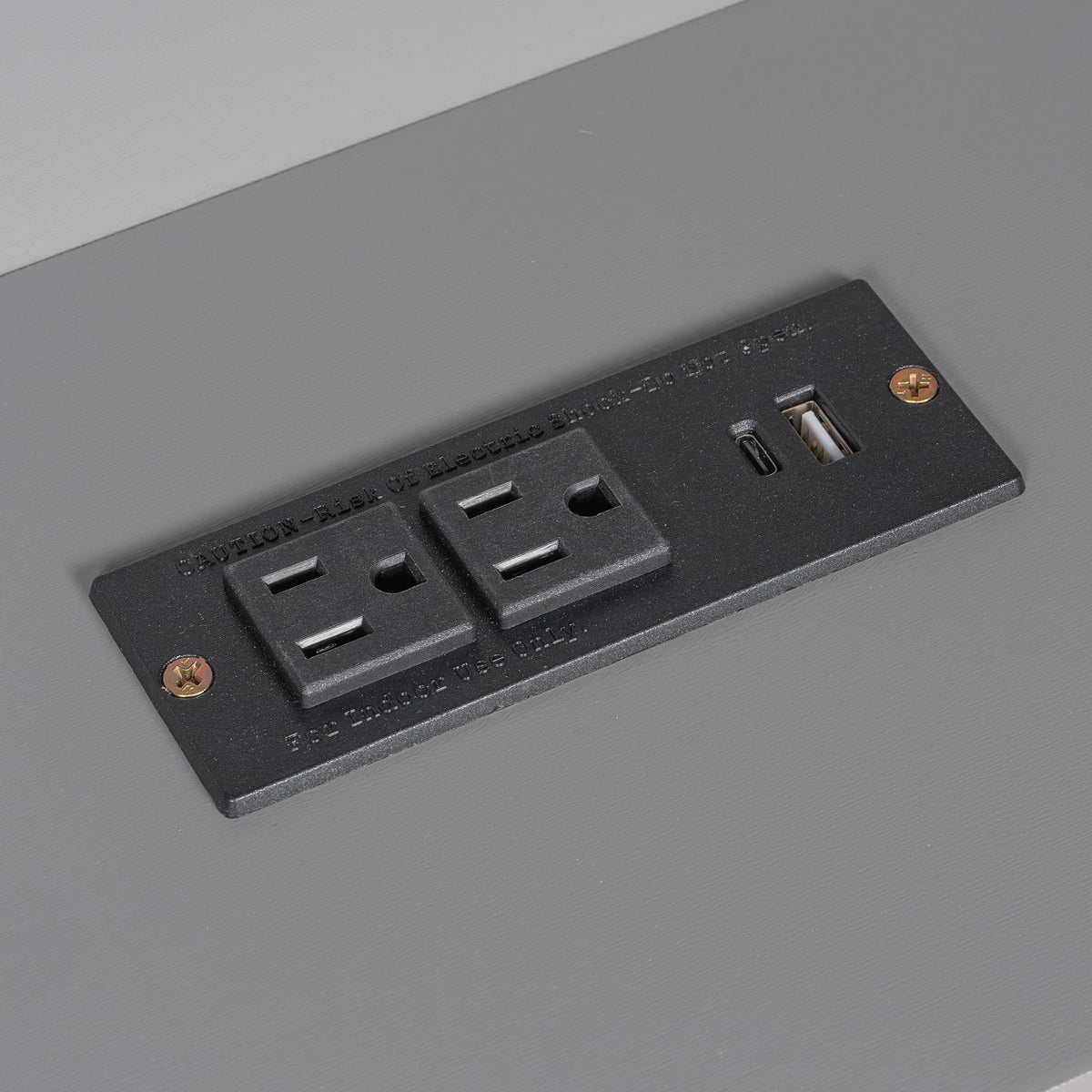 Platform bed built-in charging panel with USB ports on a black insert set into a gray bed surface on Tampa Home & Garden Store