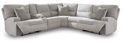 Acklen Place reclining sectional in light gray fabric with 2 patterned pillows and cupholders on Tampa Home & Garden Store