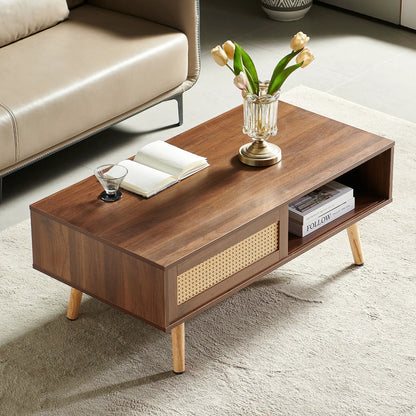 41.34-inch rattan coffee table with sliding storage doors and wood legs, vase of tulips on top on Tampa Home & Garden Store