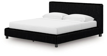 Zuraleus upholstered bed by Unique Piece Furniture with black tufted headboard on Tampa Home & Garden Store