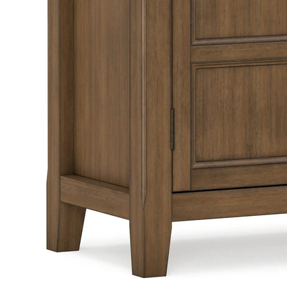 Burlington handcrafted low storage cabinet in warm brown wood with paneled doors and tapered legs on Tampa Home & Garden Store