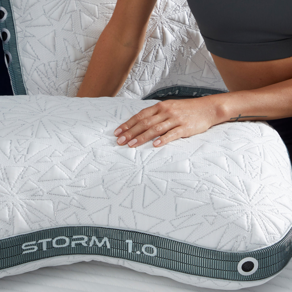 BedGear Storm Cuddle Curve Pillow 1.0 backrest pillow in white quilted fabric with teal strap on Tampa Home & Garden Store