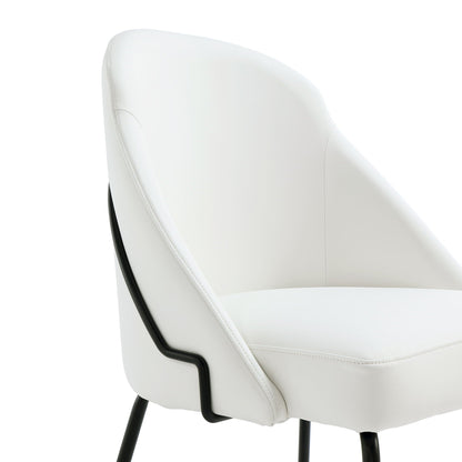 Modern vegan upholstered dining chair with dense foam, white faux leather and black frame on Tampa Home & Garden Store