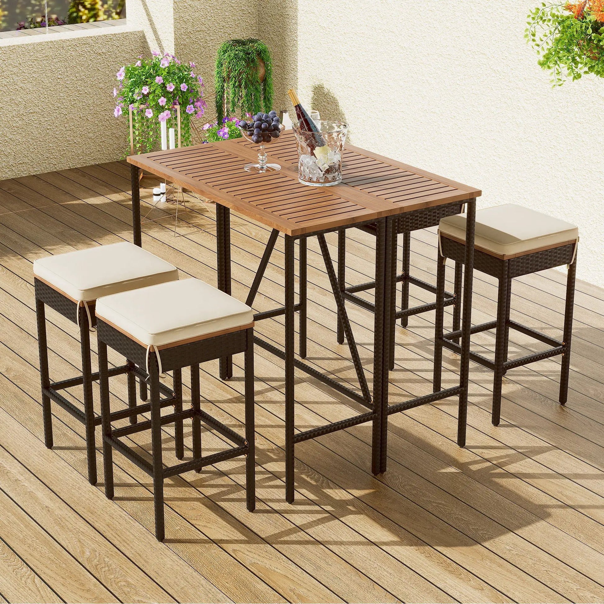 Outdoor acacia wood bar-height dining set with eight cushioned stools on a deck on Tampa Home & Garden Store