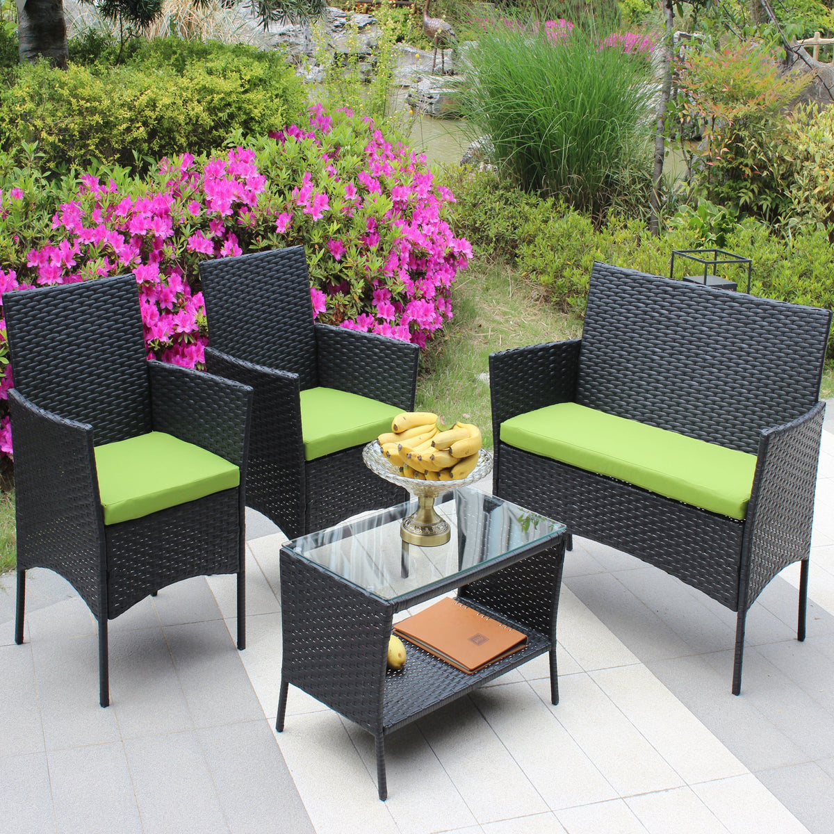 4 pc rattan patio furniture set with black wicker and lime cushions on Tampa Home & Garden Store