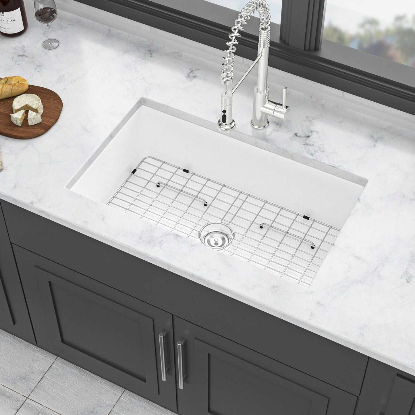 Undermount kitchen sink with metal grid, white ceramic bowl and chrome faucet on Tampa Home & Garden Store