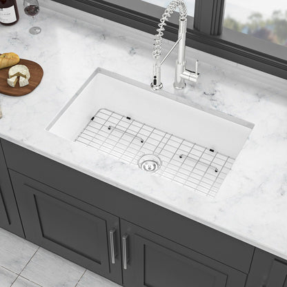 Undermount kitchen sink with metal grid, white ceramic bowl and chrome faucet on Tampa Home & Garden Store