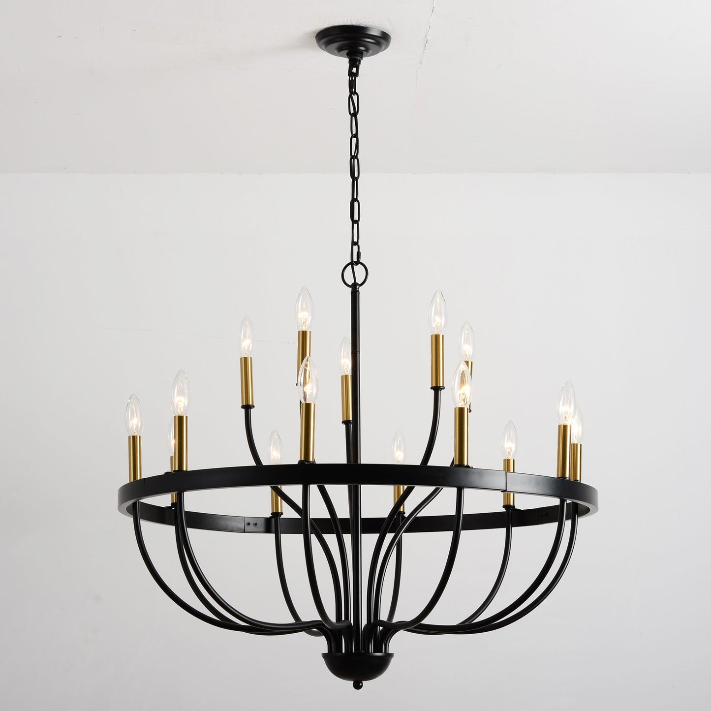 15-light industrial iron chandelier with black frame and gold sleeves hanging from chain on Tampa Home & Garden Store