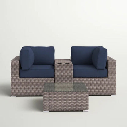 3-piece wicker outdoor seating set with navy cushions and glass-topped coffee table on Tampa Home & Garden Store