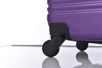HouseOfZazla purple hardshell spinner luggage wheel close-up on Tampa Home & Garden Store