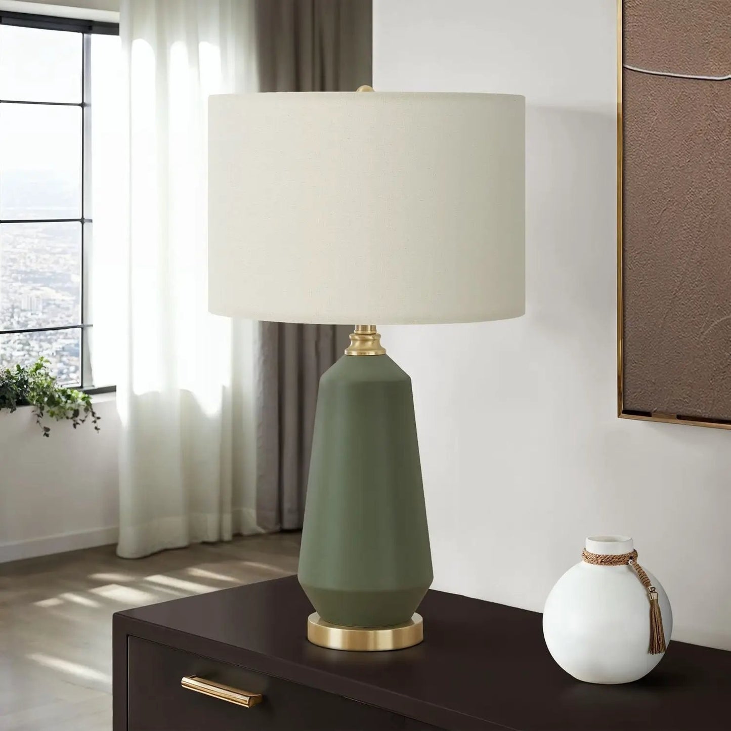 Table lamp green ceramic base, brass accents, cream shade in contemporary style atop console on Tampa Home & Garden Store