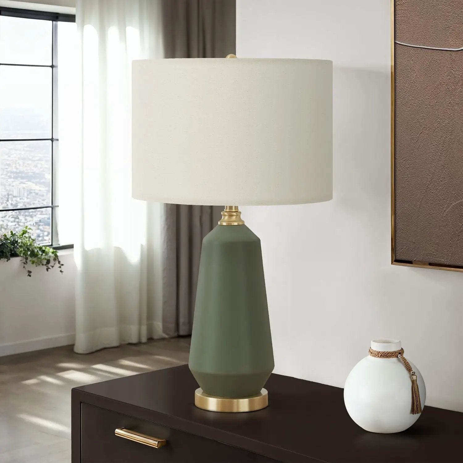 Table lamp green ceramic base, brass accents, cream shade in contemporary style atop console on Tampa Home & Garden Store