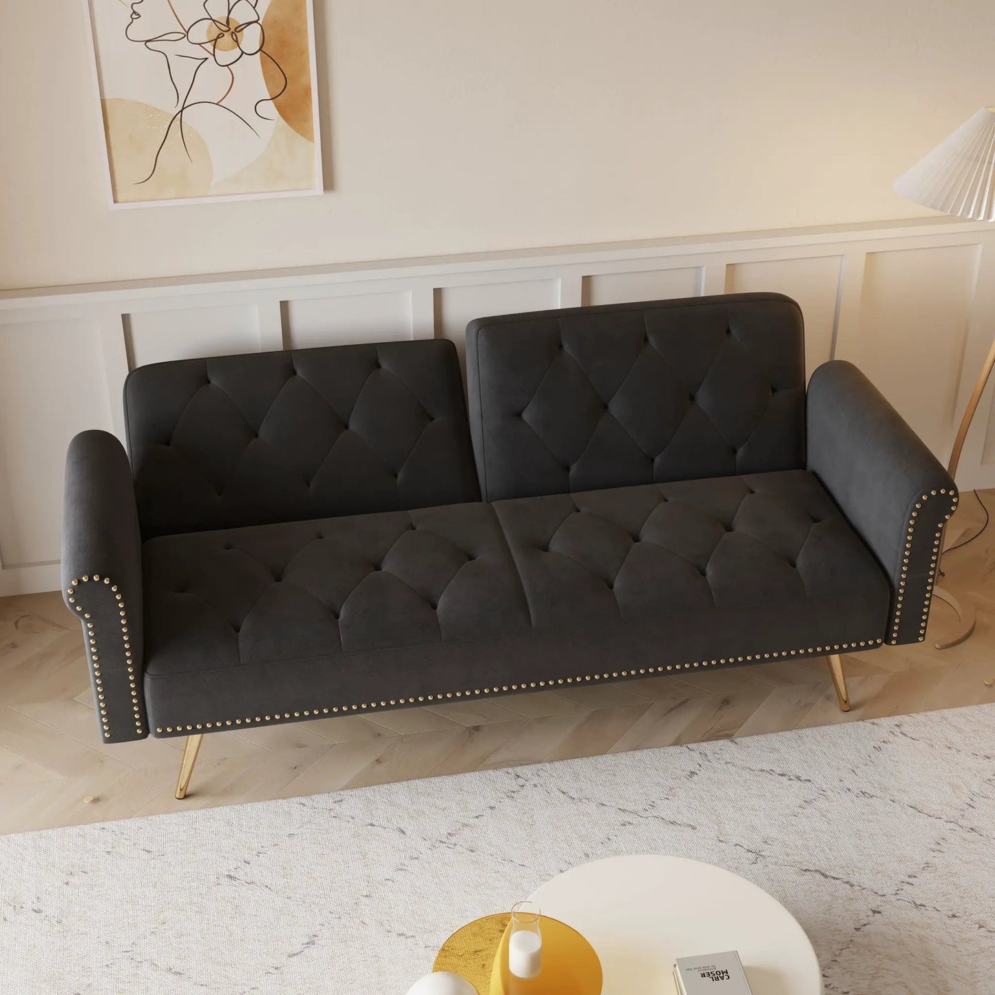 Luxurious dark gray tufted futon sofa bed with nailhead trim and matching pillow on Tampa Home & Garden Store