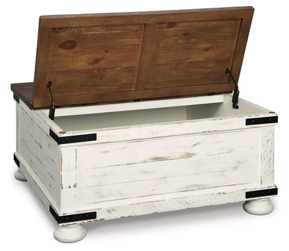 Wystfield cocktail table with storage, white distressed base and brown lift-top lid on Tampa Home & Garden Store