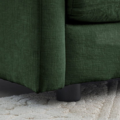 Modern fabric loveseat in dark green velvet with black legs resting on beige carpet on Tampa Home & Garden Store