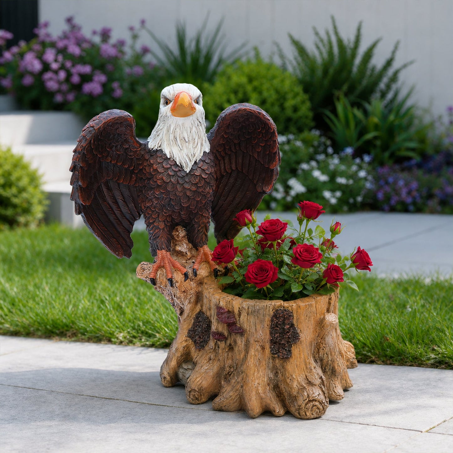 Majestic eagle garden planter pot statue with spread wings and white head, red roses at base on Tampa Home & Garden Store