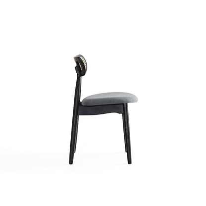 Dining chair with cane backrest, black frame and light gray cushioned seat on Tampa Home & Garden Store