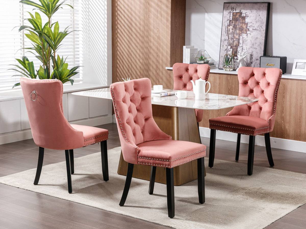 Tufted velvet dining chair set in pink with nailhead trim, four chairs around marble table on Tampa Home & Garden Store