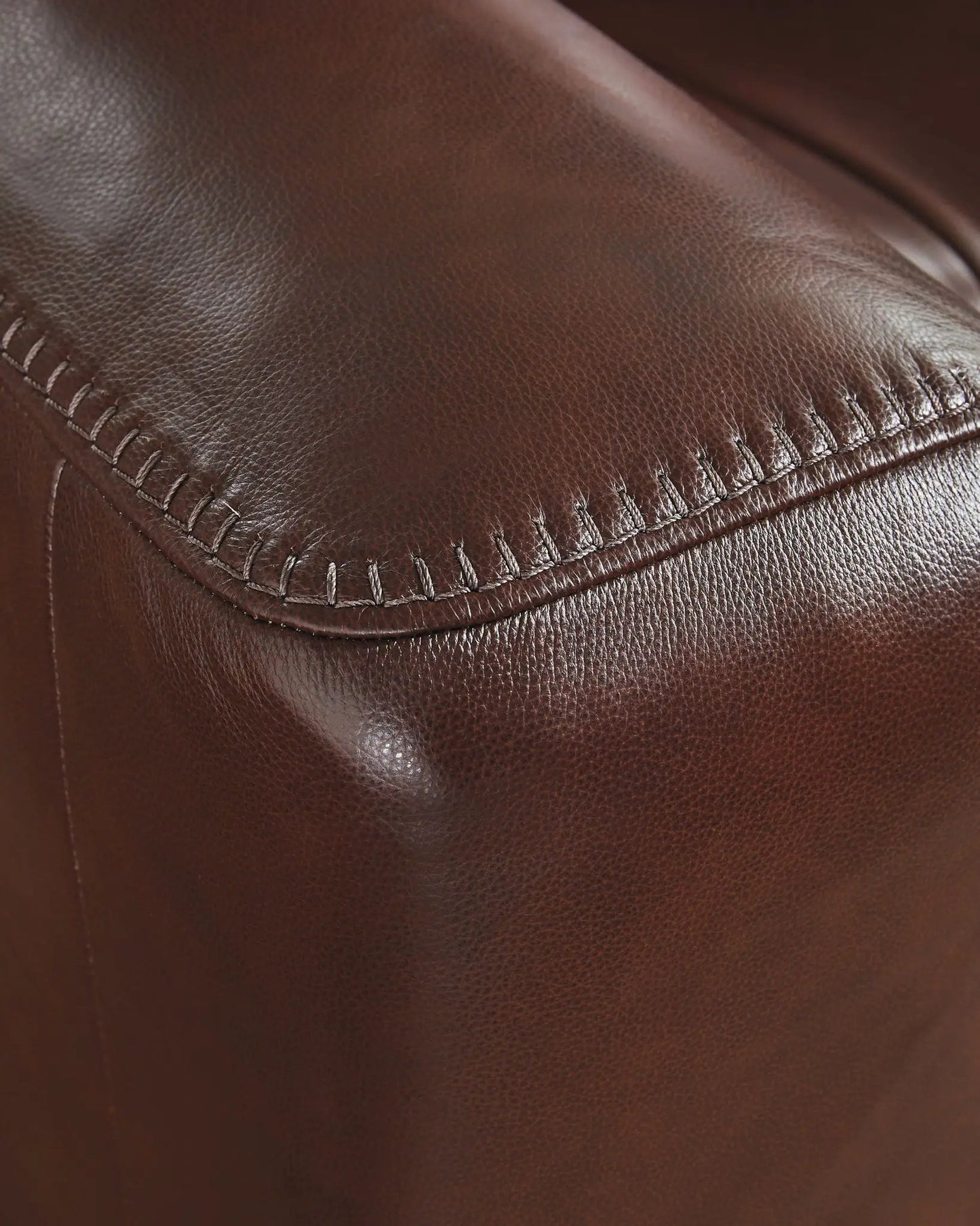 Bexhurst Power Reclining Sofa Unique Piece Furniture brown leather upholstery with visible stitching on Tampa Home & Garden Store