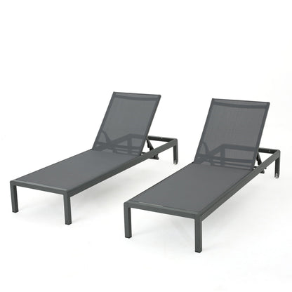 Two dark gray outdoor chaise lounges with mesh fabric and adjustable backs on Tampa Home & Garden Store