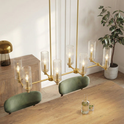 Willow 8-light island pendant with satin antique brass finish and clear ribbed glass shades on Tampa Home & Garden Store