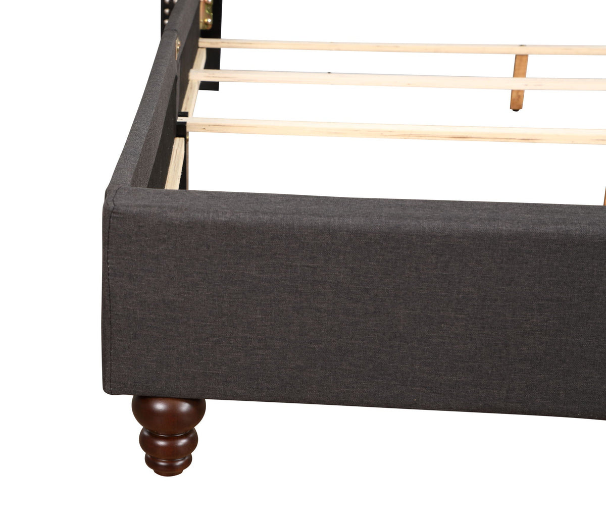 Nailhead Bed upholstered frame in charcoal gray fabric with wood slat base and turned legs on Tampa Home & Garden Store